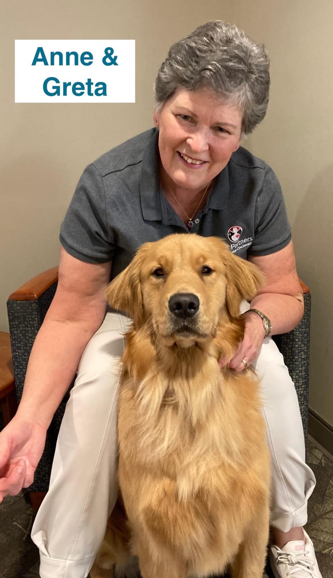 Golden retriever named Greta with her handler Anne celebratin become a therapy dog